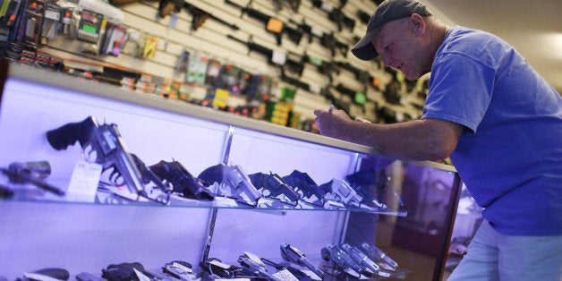 DELRAY BEACH, FL - JANUARY 05: Mark O'Connor fills out his Federal background check paperwork as he purchases a handgun at t