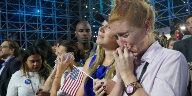 NEW YORK, UNITED STATES - NOVEMBER 09: Democratic Party's presidential nominee Hillary Clinton's supporters show their sorrow as the results indicate the Republican Party's presidential nominee Donald Trump's victory for the 2016 Presidential Elections at Jacob K. Javits Convention Center in New York, NY, USA on November 9, 2016. Republican nominee Donald Trump won victory against Democratic challenger Hillary Clinton on US presidential election. (Photo by Selcuk Acar/Anadolu Agency/Getty Images)