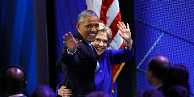 U.S. President Barack Obama and Democratic Nominee for President Hillary Clinton leave the stage at the Democratic National C