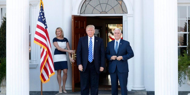 President-elect Donald Trump and Vice President-elect Mike Pence pause for photographs as they arrive at the Trump National Golf Club Bedminster clubhouse in Bedminster, N.J., Saturday, Nov. 19, 2016. (AP Photo/Carolyn Kaster)