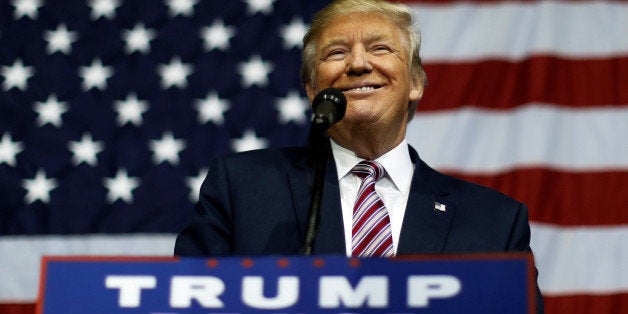 U.S. Republican presidential nominee Donald Trump smiles after making what he said was a major announcement, that he'd abide by the election results if he won, to supporters at a campaign rally in Delaware, Ohio, U.S. October 20, 2016. REUTERS/Jonathan Ernst TPX IMAGES OF THE DAY