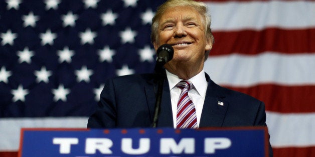 U.S. Republican presidential nominee Donald Trump smiles after making what he said was a major announcement, that he'd abide by the election results if he won, to supporters at a campaign rally in Delaware, Ohio, U.S. October 20, 2016. REUTERS/Jonathan Ernst TPX IMAGES OF THE DAY 