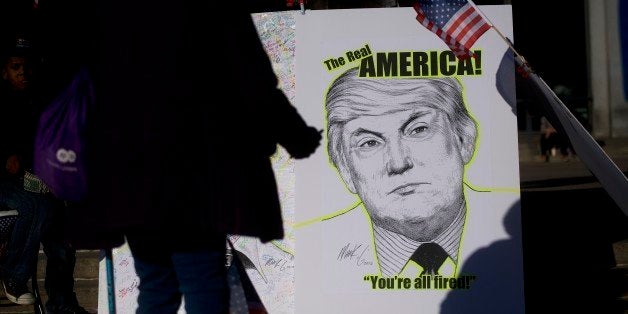 PHILADELPHIA, PA - NOVEMBER 19: Artist Mark G displays artwork for signatures during a protest against President-elect Donald Trump at Thomas Paine Plaza November 19, 2016 in Philadelphia, Pennsylvania. Today marks the 11th consecutive day of anti-Trump protests in Philadelphia, with plans to demonstrate everyday through inauguration day, January 20, 2017. (Photo by Mark Makela/Getty Images)