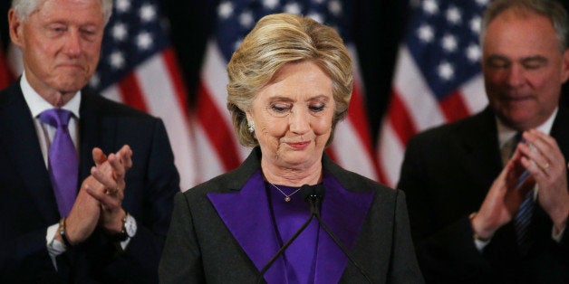 Hillary Clinton, accompanied by her husband former U.S. President Bill Clinton (L) and running mate Senator Tim Kaine, addresses her staff and supporters about the results of the U.S. election at a hotel in New York, November 9, 2016. REUTERS/Carlos Barria