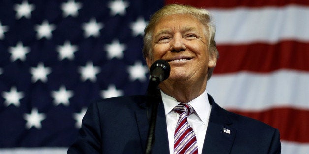 U.S. Republican presidential nominee Donald Trump smiles after making what he said was a major announcement, that he'd abide by the election results if he won, to supporters at a campaign rally in Delaware, Ohio, U.S. October 20, 2016. REUTERS/Jonathan Ernst TPX IMAGES OF THE DAY 