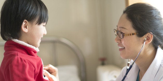 doctor and little girl patient in hospital