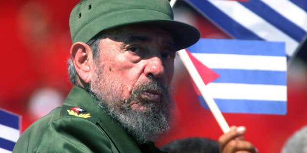 Then Cuban President Fidel Castro glances over his shoulder during the May Day commemoration at Revolution Square in Havana,