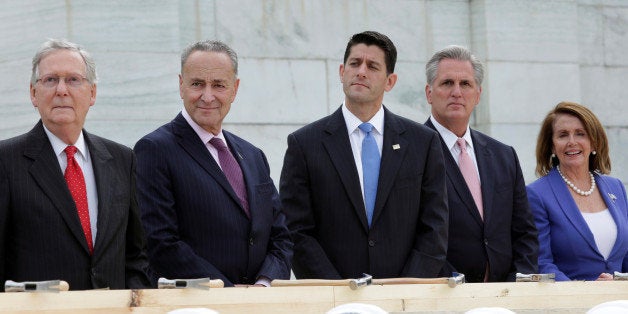 Senate Majority Leader Mitch McConnell (R-KY), Senator Chuck Schumer (D-NY), House Speaker Paul Ryan (R-WI), House Majority Leader Kevin McCarthy (R-CA) and House Minority Leader Nancy Pelosi (D-CA) participate in the "first nail ceremony" kicking off the Inauguration Platform construction on the West Front of the U.S. Capitol in Washington, U.S., September 21, 2016. REUTERS/Yuri Gripas 