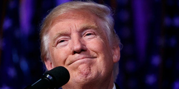 U.S. President-elect Donald Trump smiles as he arrives to speak at an election night rally, early Wednesday, Nov. 9, 2016, in