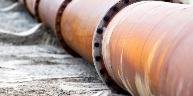 Corroded pipelines, used for land reclamation, on a beach. Holland