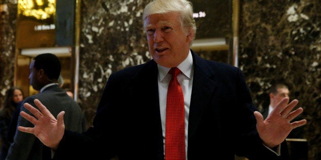 U.S. President-elect Donald Trump greets members of the press at Trump Tower in Manhattan, New York City, U.S., December 6, 2