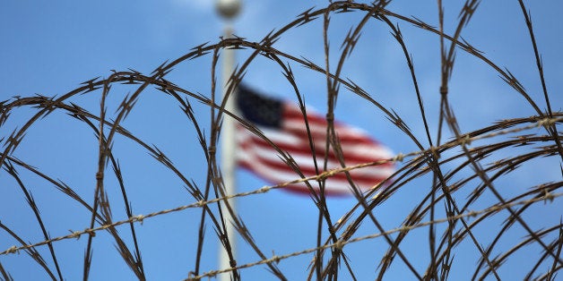 GUANTANAMO BAY, CUBA - OCTOBER 23: (EDITORS NOTE: Image has been reviewed by the U.S. Military prior to transmission.) Razor wire tops the fence of the U.S. prison at Guantanamo Bay, also known as 'Gitmo' on October 23, 2016 at the U.S. Naval Station at Guantanamo Bay, Cuba. The U.S. military's Joint Task Force Guantanamo is still holding 60 detainees at the prison, down from a previous total of 780. In 2008 President Obama issued an executive order to close the prison, which has failed because of political opposition in the U.S. (Photo by John Moore/Getty Images)