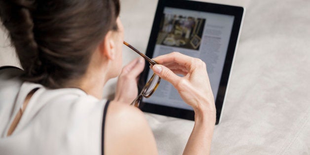 Woman looking at a digital tablet