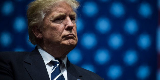 GRAND RAPIDS, MI - DECEMBER 9: President-Elect Donald J. Trump listens at a 'USA Thank You Tour 2016' event at the DeltaPlex