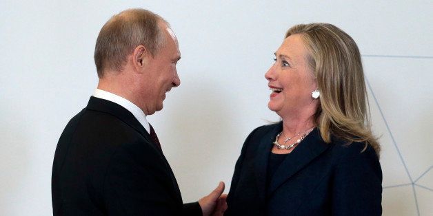 Russia's President Vladimir Putin (L) meets U.S. Secretary of State Hillary Clinton upon her arrival at the Asia-Pacific Economic Cooperation (APEC) Summit in Vladivostok September 8, 2012. REUTERS/Mikhail Metzel/Pool (RUSSIA - Tags: POLITICS) 
