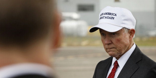 Senator Jeff Sessions (R-AL) waits for U.S. President-elect Donald Trump to exit his plane after arriving for stop on his USA Thank You Tour event in Mobile, Alabama, U.S., December 17, 2016. REUTERS/Lucas Jackson