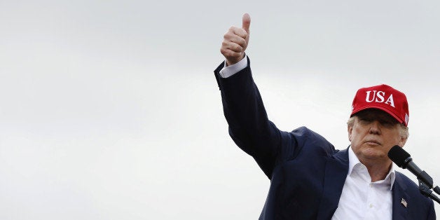 U.S. President-elect Donald Trump gestures as he speaks during a USA Thank You Tour event in Mobile, Alabama, U.S., December