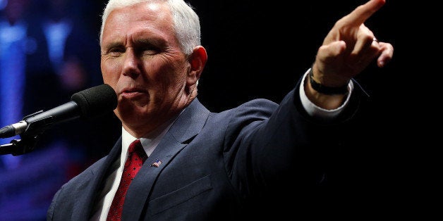 Republican vice presidential nominee Mike Pence attends a campaign rally in Manchester, New Hampshire, U.S. November 7, 2016. REUTERS/Carlo Allegri