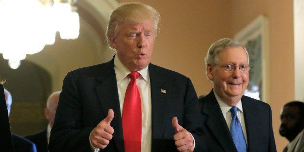 U.S. President-elect Donald Trump (L) gives a thumbs up sign as he walks with Senate Majority Leader Mitch McConnell (R-KY) on Capitol Hill in Washington, U.S., November 10, 2016. REUTERS/Joshua Roberts