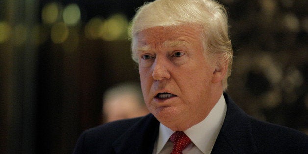 U.S. President-elect Donald Trump speaks to members of the news media in the main lobby at Trump Tower in Manhattan, New York
