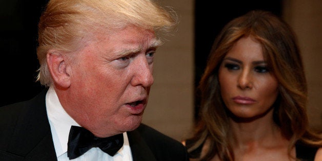 U.S. President-elect Donald Trump talks to reporters as he and his wife Melania Trump arrive for a New Year's Eve celebration with members and guests at the Mar-a-lago Club in Palm Beach, Florida, U.S. December 31, 2016. REUTERS/Jonathan Ernst