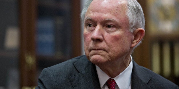 Senator Jeff Sessions, attorney general pick for U.S. President-elect Donald Trump, listens as Senator Charles 'Chuck' Grassl