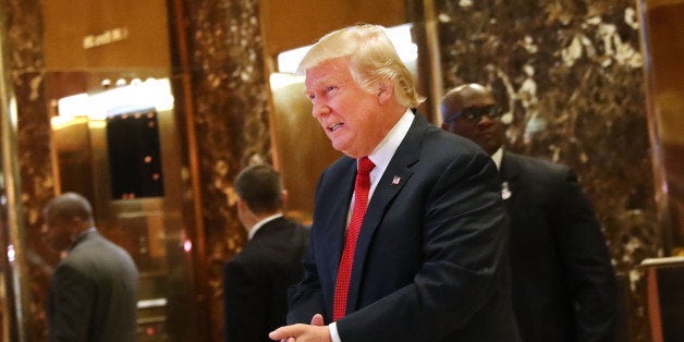 NEW YORK, NY - DECEMBER 06: President-elect Donald Trump pauses to briefly speak to the media at Trump Tower on December 6, 2016 in New York City. Potential members of President-elect Donald Trump's cabinet have been meeting with him and his transition team of the last few weeks. (Photo by Spencer Platt/Getty Images)