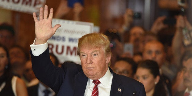 New York City - NY - USA - September 3 2015: Republican presidential candidate Donald Trump wave to press after a press conference at Trump Tower to announce he has signed a pledge not to run as an independent candidate