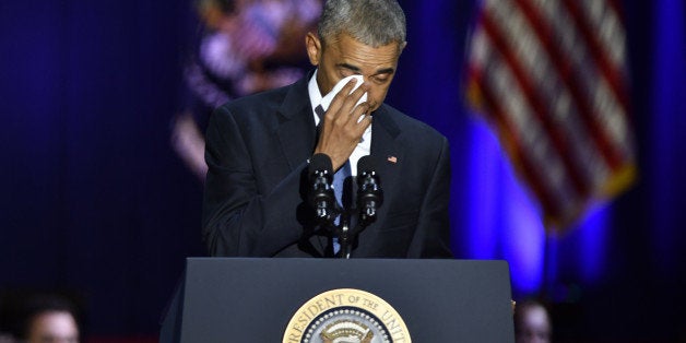 U.S. President Barack Obama wipes his tears while speaking about U.S. First Lady Michelle Obama, not pictured, during his farewell address in Chicago, Illinois, U.S., on Tuesday, Jan. 10, 2017. Obama blasted 'zero-sum' politics as he drew a sharp contrast with his successor in his farewell address Tuesday night, acknowledging that despite his historic election eight years ago his vision for the country will exit the White House with him. Photographer: Christopher Dilts/Bloomberg via Getty Images