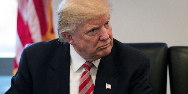 NEW YORK, NY - DECEMBER 14: President-elect Donald Trump listens during a meeting with technology executives at Trump Tower,