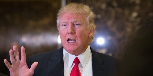 President-elect Donald Trump speaks to the media following a meeting with Steve Harvey at Trump Tower on January 13, 2017 in New York. / AFP / Bryan R. Smith (Photo credit should read BRYAN R. SMITH/AFP/Getty Images)