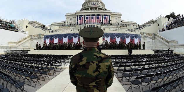 The United States Marine Corps Band practices in front of the podium where US President-elect Donald Trump will take the oath of office and be sworn in as the 45th US president in Washington, DC on January 19, 2017. Twenty-four hours before he takes the oath of office as the 45th US president, Trump arrived in Washington on Thursday, determined to transform American politics over the next four years. / AFP / TIMOTHY A. CLARY (Photo credit should read TIMOTHY A. CLARY/AFP/Getty Images)