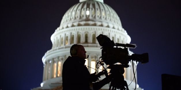 The US Capitol Building is pictured as media gather on January 20, 2017 in Washington, DC. Donald Trump will be sworn in as the 45th president of the United States Friday -- capping his improbable journey to the White House and beginning a four-year term that promises to shake up Washington and the world. / AFP / Robyn Beck (Photo credit should read ROBYN BECK/AFP/Getty Images)