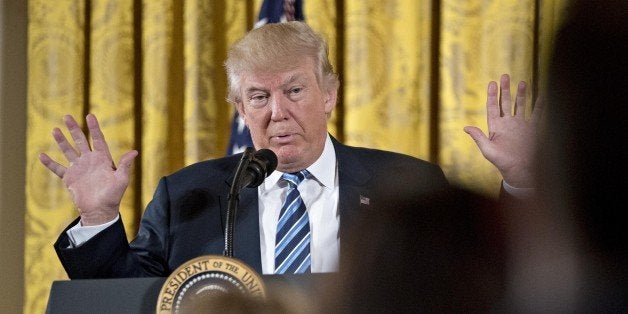 U.S. President Donald Trump speaks during a swearing in ceremony of White House senior staff in the East Room of the White House in Washington, D.C., U.S., on Sunday, Jan. 22, 2017. Trump today mocked protesters who gathered for large demonstrations across the U.S. and the world on Saturday to signal discontent with his leadership, but later offered a more conciliatory tone, saying he recognized such marches as a hallmark of our democracy. Photographer: Andrew Harrer/Bloomberg via Getty Images