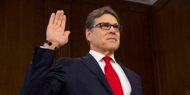 WASHINGTON, DC, UNITED STATES - 2017/01/19: Former Texas Governor Rick Perry, President-elect Donald Trump's choice as Secretary of Energy, is sworn in at his confirmation hearing before the Senate Committee on Energy and Natural Resources on Capitol Hill January 19, 2017 in Washington, DC. Perry is expected to face questions about his connections to the oil and gas industry. (Photo by Stephen J. Boitano/LightRocket via Getty Images)