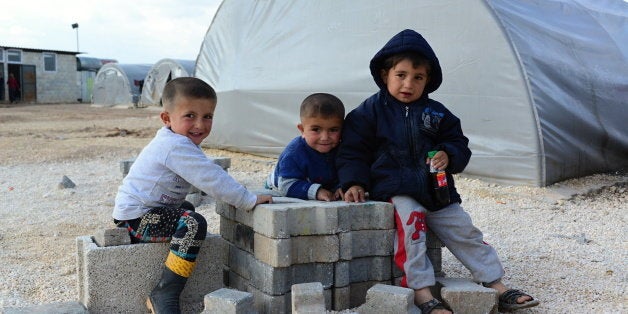 Suruc, Turkey - April 3, 2015: Syrian people in refugee camp in Suruc. These people are refugees from Kobane and escaped because of Islamic state attack.