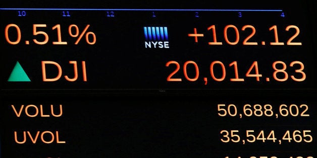 A display on the main trading floor of the New York Stock Exchange (NYSE) shows the Dow Jones Industrial Average over the 20,