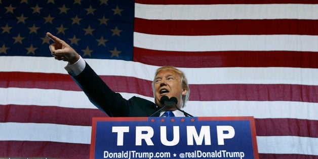 MESA, AZ - DECEMBER 16: Republican presidential candidate Donald Trump speaks to guest gathered during a campaign event at t