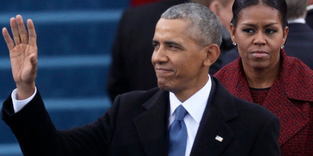 President Barack Obama and First Lady Michelle Obama (R) look on at inauguration ceremonies swearing in Donald Trump as the 45th president of the United States on the West front of the U.S. Capitol in Washington, U.S., January 20, 2017. REUTERS/Carlos Barria