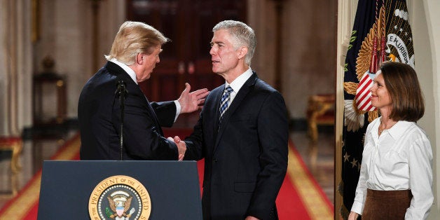 WASHINGTON, DC - JANUARY 31: President Trump shakes the hand of Judge Neil Gorsuch during a Supreme Court of the United State