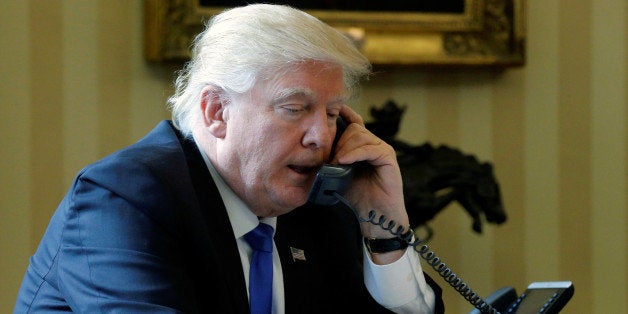 U.S. President Donald Trump speaks by phone with Russia's President Vladimir Putin in the Oval Office at the White House in W