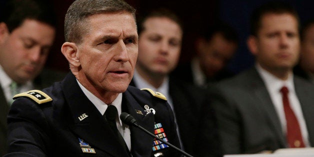 Defense Intelligence Agency director U.S. Army Lt. General Michael Flynn testifies before the House Intelligence Committee on "Worldwide Threats" in Washington February 4, 2014. REUTERS/Gary Cameron (UNITED STATES - Tags: CRIME LAW POLITICS MILITARY)