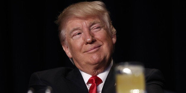 U.S. President Donald Trump, smiles while being introduced during the National Prayer Breakfast in Washington, D.C., U.S., on Thursday, Feb. 2, 2017. For the first time in decades, America's oldest allies are questioning where Washington's heart is. 'The world is in trouble -- but we're going to straighten it out, ok? That's what I do,' Trump said to an audience of religious and political leaders at the National Prayer Breakfast. Photographer: Win McNamee/ Pool via Bloomberg