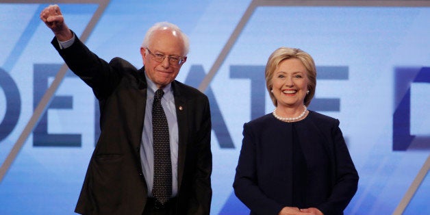 Democratic U.S. presidential candidates Senator Bernie Sanders and Hillary Clinton pose before the start of the Univision New