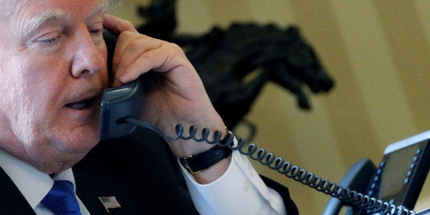 U.S. President Donald Trump speaks by phone with Russia's President Vladimir Putin in the Oval Office at the White House in Washington, U.S. January 28, 2017. REUTERS/Jonathan Ernst