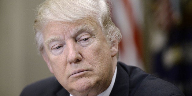 U.S. President Donald Trump listens during a parent-teacher conference listening session inside the Roosevelt Room of the Whi