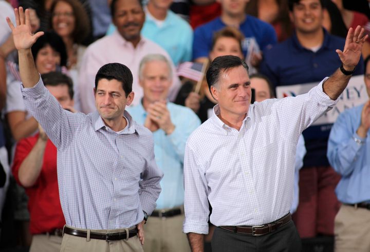 WAUKESHA, WI - AUGUST 12: Republican presidential candidate and former Massachusetts Gov. Mitt Romney and vice presidential candidate and Wisconsin native Rep. Paul Ryan (R-WI) (L) greet supporters during a campaign event at the Waukesha Expo Center on August 12, 2012 in Waukesha, Wisconsin. Romney continues his four day bus tour a day after announcing his running mate, Rep. Paul Ryan. (Photo by Darren Hauck/Getty Images)