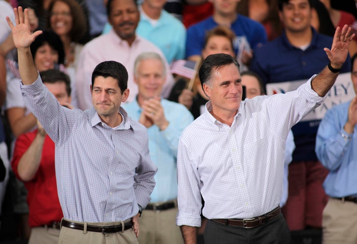 WAUKESHA, WI - AUGUST 12: Republican presidential candidate and former Massachusetts Gov. Mitt Romney and vice presidential candidate and Wisconsin native Rep. Paul Ryan (R-WI) (L) greet supporters during a campaign event at the Waukesha Expo Center on August 12, 2012 in Waukesha, Wisconsin. Romney continues his four day bus tour a day after announcing his running mate, Rep. Paul Ryan. (Photo by Darren Hauck/Getty Images)