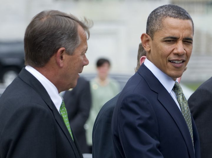 US President Barack Obama and Speaker of the House John Boehner (L) speak following a St. Patrick's Day Luncheon at the US Capitol in Washington, DC, March 20, 2012. AFP PHOTO / Saul LOEB (Photo credit should read SAUL LOEB/AFP/Getty Images)