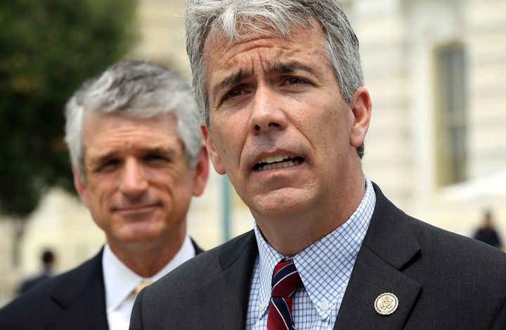WASHINGTON, DC - MAY 16: U.S. Rep. Joe Walsh (R-IL) (R) speaks as Rep. Scott Rigell (R-VA) (L) listens during a news conference to announce the formation of the 'Fix Congress Now Caucus' May 16, 2012 on Capitol Hill in Washington, DC. A group of bi-partisan congressional members have formed the caucus hoping to 'prohibit members of Congress from receiving pay after October 1 for any fiscal year in which Congress has not approved a concurrent resolution on the budget and passed the regular appropriations bills.' (Photo by Alex Wong/Getty Images)